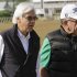 Trainer Bob Baffert, left and Bernie Schiappa walk off the track after watching Bodemeister in a morning workout at Pimlico Race Course, Thursday, May 17, 2012, in Baltimore. Bodemeister is entered in Saturday's Preakness Stakes at Pimlico. (AP Photo/Garry Jones)