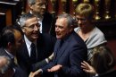 Piero Grasso is congratulated after the vote electing him as the new Senate president at the Senate in Rome