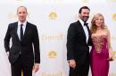 Tony Hale, from left, Jon Hamm and Jennifer Westfeldt arrive at the 66th Annual Primetime Emmy Awards at the Nokia Theatre L.A. Live on Monday, Aug. 25, 2014, in Los Angeles. (Photo by Jordan Strauss/Invision/AP)
