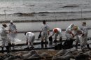 Photos: 50 tons of spilled oil ruin beloved Thai beach