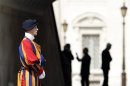 Swiss guard stands before the arrival of Pope Benedict XVI for his weekly general audience at Saint Peter's Square in the Vatican