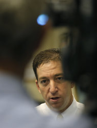 Glenn Greenwald, a reporter of Britain's The Guardian newspaper, speaks to The Associated Press in Hong Kong Tuesday, June 11, 2013. Greenwald, the journalist who interviewed Edward Snowden, a 29-year-old contractor who allowed himself to be revealed as the source of disclosures about the U.S. government's secret surveillance programs, said he had been in touch with Snowden, but declined to say whether he was still in Hong Kong and said he didn’t know what his future plans were. (AP Photo/Vincent Yu)
