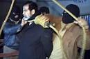 A video grab taken from al-Iraqiya television shows ousted Iraq president Saddam Hussein moments before being hanged in Baghdad, December 30, 2006