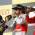 McLaren driver Hamilton, Red Bull driver Vettel and Ferrari driver Alonso drink champagne on the podium after the U.S. F1 Grand Prix in Austin