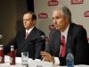 Alex Behring, Managing Partner at 3G Capital, talks as Heinz Chairman, President and CEO William R. Johnson listens during a news conference to announce that Heinz has agreed to be bought by Berkshire Hathaway and 3G Capital, in Pittsburgh