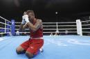 Thailand's Amnat Ruenroeng prays after winning a match against Argentina's Perrin Ignacio during a men's lightweight 60-kg preliminary boxing match at the 2016 Summer Olympics in Rio de Janeiro, Brazil, Sunday, Aug. 7, 2016. (AP Photo/Frank Franklin II)