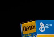 The General Mills logo is seen on a box of Cheerios cereal in Evanston, Illinois in this file photo taken June 26, 2012. General Mills Inc reported higher quarterly earnings on Wednesday, helped by higher sales volume. The maker of Cheerios cereal said net income was $548.9 million, or 82 cents per share, for the fiscal first quarter, ended Aug. 26, compared with $405.6 million, or 61 cents per share, in the year-earlier period. REUTERS/Jim Young/Files