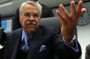 Saudi Arabia's Minister of Petroleum and Mineral Resources Ali Ibrahim Naimi gestures as he talks to journalists prior to the start of a meeting of the Organization of the Petroleum Exporting Countries, OPEC, at their headquarters in Vienna, Austria, Wednesday, Dec. 4, 2013. The OPEC ministers are meeting to decide on the cartel's oil output against a backdrop of slowing crude demand and unrest in member nation Libya. (AP Photo/Ronald Zak)