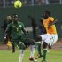 Ivory Coast's Kolo Eboue Emmanuel R fight for the ball with with Senegal s Diame N Doye L during their African nation cup qualifier soccer match in Abidjan September 8, 2012.