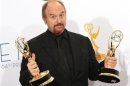 Louis C.K. holds the Emmy awards for outstanding writing for a variety special for "Louis C.K. Live at the beacon Theatre" and outstanding writing in a comedy series for his show "Louie" at the 64th Primetime Emmy Awards in Los Angeles