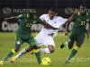 Ahmed Zuway of Libya challenges Cheikh MBengue and Mohamed Diamé of Senegal during their African Nations Cup Group A match in Bata