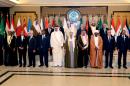Arab leaders pose for a group photograph during the opening session of the Arab League Summit in Bayan Palace, Kuwait City, Tuesday, March 25, 2014. (AP Photo/Nasser Waggi)