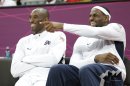 USA's Lebron James, right, and Kobe Bryant react during the second half of a preliminary men's basketball game against France at the 2012 Summer Olympics, Sunday, July 29, 2012, in London. (AP Photo/Eric Gay)