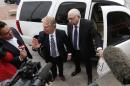 Robert Bates, right, arrives at the Tulsa County Jail with his attorney, Clark Brewster, Tuesday, April 14, 2015, in Tulsa, Okla. Bates, a 73-year-old Oklahoma volunteer sheriff's deputy who authorities said fatally shot a suspect after confusing his stun gun and handgun, was booked into the county jail Tuesday on a manslaughter charge. (Matt Barnard/Tulsa World via AP)