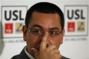 Romania's Prime Minister and Social Liberal Union alliance leader Ponta gestures during a news conference in Bucharest