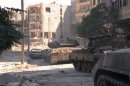 Syrian army tanks are seen in the Suleiman al-Halabi neighborhood after clashes between Free Syrian Army fighters and regime forces, in Aleppo city