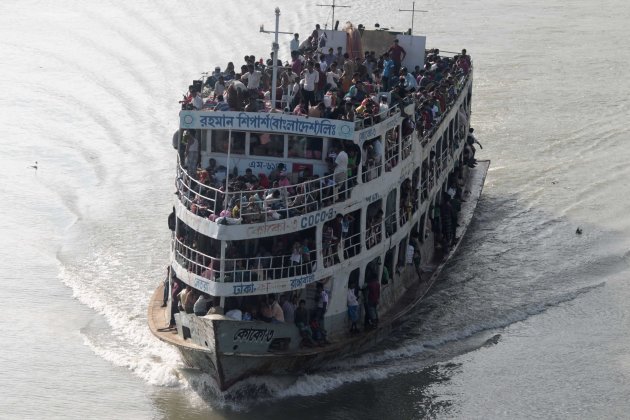 Overcrowded passenger boat is seen on the Buriganga River in Dhaka.