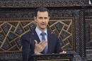 Syria's President Bashar al-Assad delivers a speech to Syria's parliament in Damascus