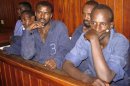 Suspected Somali pirates stand in the dock inside a courtroom in the Kenyan coastal town of Mombasa