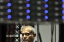 In this Thursday, Dec. 20, 2012, photo, Chet Kanojia, founder and CEO of Aereo, Inc., listens during a tour of the company's technology floor in New York. Aereo is one of several startups created to deliver traditional media over the Internet without licensing agreements. Past efforts have typically been rejected by courts as copyright violations. In Aereo's case, the judge accepted the company's legal reasoning, but with reluctance. (AP Photo/Bebeto Matthews)