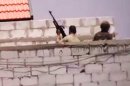 This image made from amateur video released by the Ugarit News and accessed Tuesday, July 31, 2012, purports to show Syrian government forces in Damascus, Syria. (AP Photo/Ugarit News via AP video) THE ASSOCIATED PRESS IS UNABLE TO INDEPENDENTLY VERIFY THE AUTHENTICITY, CONTENT, LOCATION OR DATE OF THIS HANDOUT PHOTO