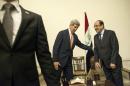 Iraqi Prime Minister Nuri al-Maliki (R) and US Secretary of State John Kerry meet at the Prime Minister's Office in Baghdad on June 23, 2014