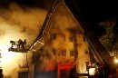 Bangladeshi firefighters battle a fire at a garment factory in the Savar neighborhood in Dhaka, Bangladesh, late Saturday, Nov. 24, 2012. At least 112 people were killed in a fire that raced through the multi-story garment factory just outside of Bangladesh's capital, an official said Sunday. (AP Photo/Hasan Raza)