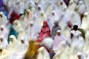Muslim women perform an evening prayer called 'tarawih' marking the first eve of the holy fasting month of Ramadan at Istiqlal Mosque in Jakarta, Indonesia, Friday, July 20, 2012. During Ramadan, the holiest month in Islamic calendar, Muslims refrain from eating, drinking, smoking and sex from dawn to dusk. (AP Photo/Dita Alangkara)