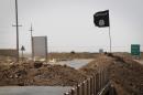 A flag of the Islamic State (IS) is seen in Iraq on September 11, 2014.