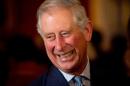 Britain's Prince Charles meets guests during a reception in Clarence House, central London on October 24, 2013