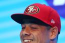 Jarryd Hayne smiles as he announces his free agent contract with the National Football League team the San Francisco 49ers at a press conference in Sydney, Tuesday, March 3, 2015. Australian rugby star Hayne has agreed to a contract with the San Francisco 49ers, a person with knowledge of the deal said Tuesday. (AP Photo/Rick Rycroft)