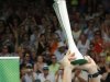 Ferrer celebrates by raising the trophy after beating Kohlschreiber during their men's singles final match at the Heineken Open in Auckland