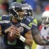Seattle Seahawks quarterback Russell Wilson (3) passes against the Arizona Cardinals during the first half of an NFL football game in Seattle, Sunday, Dec. 9, 2012. (AP Photo/Stephen Brashear)