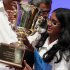 Snigdha Nandipati, 14, of San Diego, holds the trophy after winning the National Spelling Bee with the word "guetapens" Thursday, May 31, 2012 in Oxon Hill, Md. (AP Photo/Alex Brandon)
