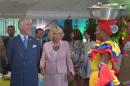 Prince Charles of Wales (L) and his wife Camilla, Duchess of Cornwall, visit an organic fair in Bogota on October 29, 2014