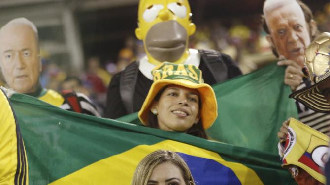 Brazil and Colombia fans await the start of their teams&#39; first round Copa America 2015 soccer match at Estadio Monumental David Arellano in Santiago