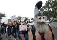 Demonstrators chant and walk during a protest march, Sunday, Aug. 26, 2012, in St Petersburg, Fla. Hundreds of protestors gathered a park in downtown St. Petersburg to march in demonstration against the Republican National Convention. (AP Photo/Patrick Semansky)