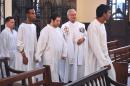Father Lusarreta (2-R) and boys with Down syndrome and learning difficulties attend a mass at La Milagrosa Church in Havana, on September 15, 2015