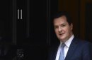 Britain's Chancellor of the Exchequer George Osborne walks out of his official residence of 11 Downing Street in London