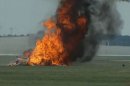 This photo provided provided WHIO TV shows a plane after it crashed Saturday, June 22, 2013, at the Vectren Air Show near Dayton, Ohio. There was no immediate word on the fate of the pilot, wing walker or anyone else aboard the plane. No one on the ground was hurt. (AP Photo/WHIO-TV)