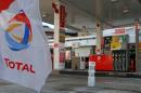 The logo of French oil company Total is seen at a Total gas station in Paris