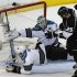 San Jose Sharks Joe Pavelski dives to block the puck in front of goalie Antti Niemi as Los Angeles Kings Dustin Penner looks on during their NHL Western Conference semi finals hockey playoff in Los Angeles