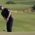Donald of England hits onto the 18th green during the fourth and final round of the DP World Tour Championship at Jumeirah Golf Estates in Dubai