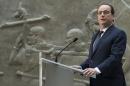 French president Francois Hollande delivers a speech after touring the Oriental antiquities department of the Louvre museum, in Paris, France, Wednesday, March 18, 2015. Hollande has issued a call to preserve the cultural heritage threatened by Islamic State extremists in Iraq and Syria. (AP Photo/Ian Langsdon, Pool)