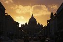 Saint Peter's Basilica at the Vatican is silhouetted during sunset in Rome
