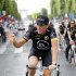 Radioshack team rider Lance Armstrong of the U.S. waves on the Champs Elysees during the final parade of the 97th Tour de France cycling race in Paris