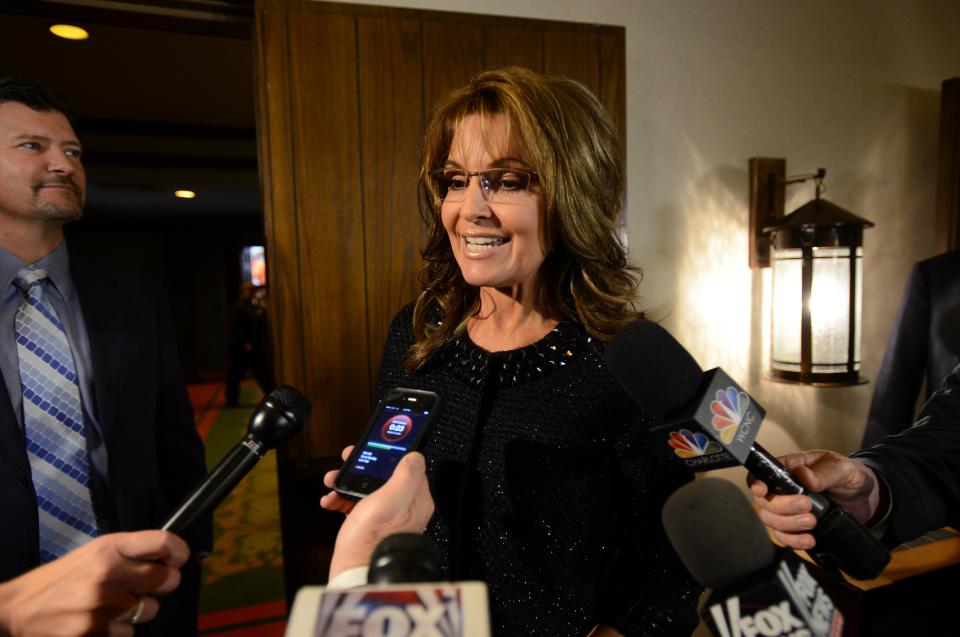 Former Alaska governor Sarah Palin talks to the media before Billy Graham's 95th birthday party at the Grove Park Inn in Asheville, N.C., Thursday Nov. 7, 2013. (AP Photo/The Asheville Citizen-Times, Erin Brethauer) NO SALES