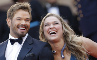 Actor Kellan Lutz, left, and Ronda Rousey, from the movie The Expendables 3, arrive at the Cannes film festival. (AP)