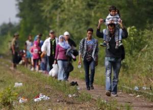 Syrian immigrants walk on a railway track after they&nbsp;&hellip;