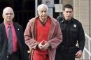 Convicted child molester Jerry Sandusky leaves after his appeal hearing at the Centre County Courthouse in Bellefonte, Pennsylvania